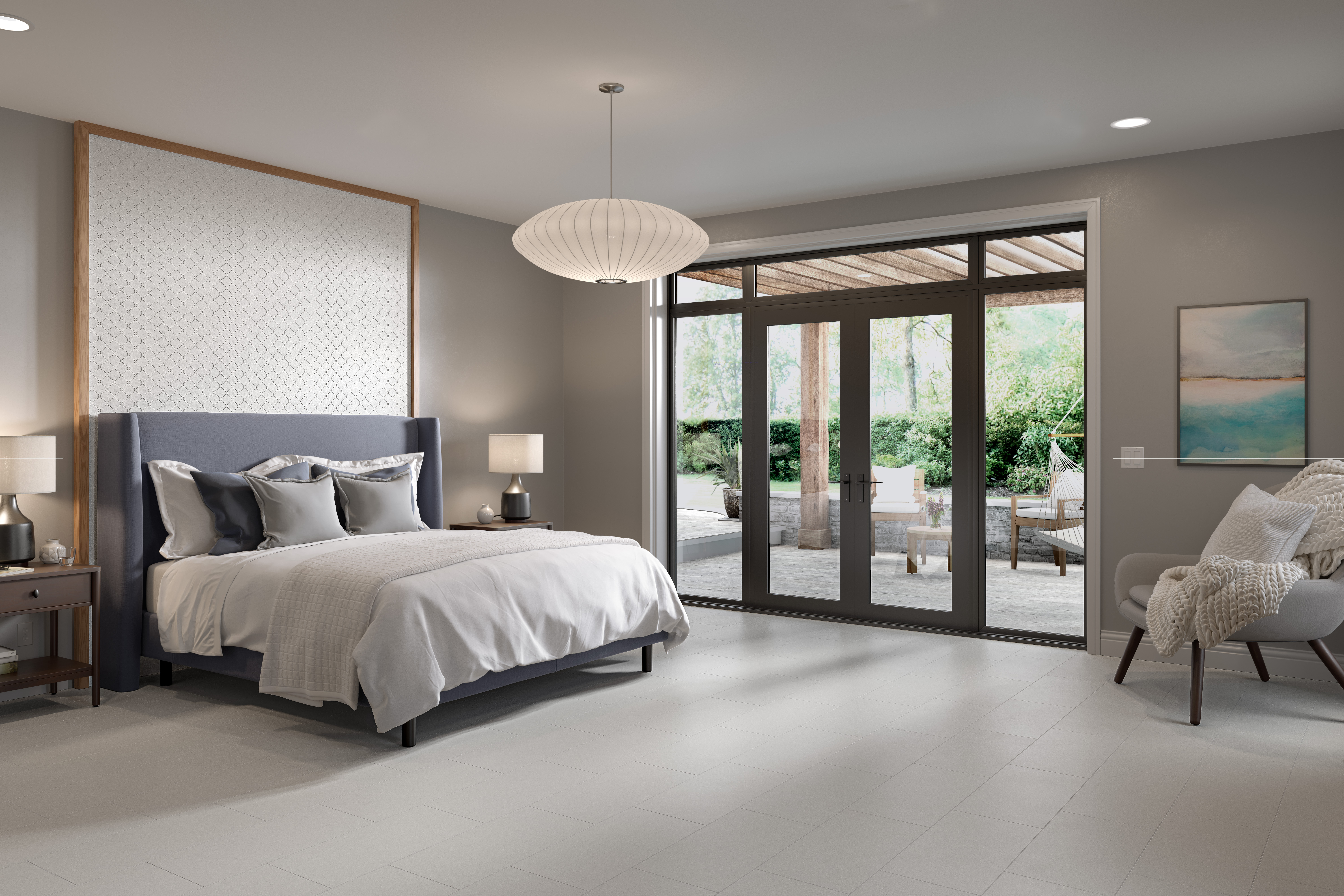 Open layout bedroom scene with white porcelain tile, queen bed, and sliding door view to patio